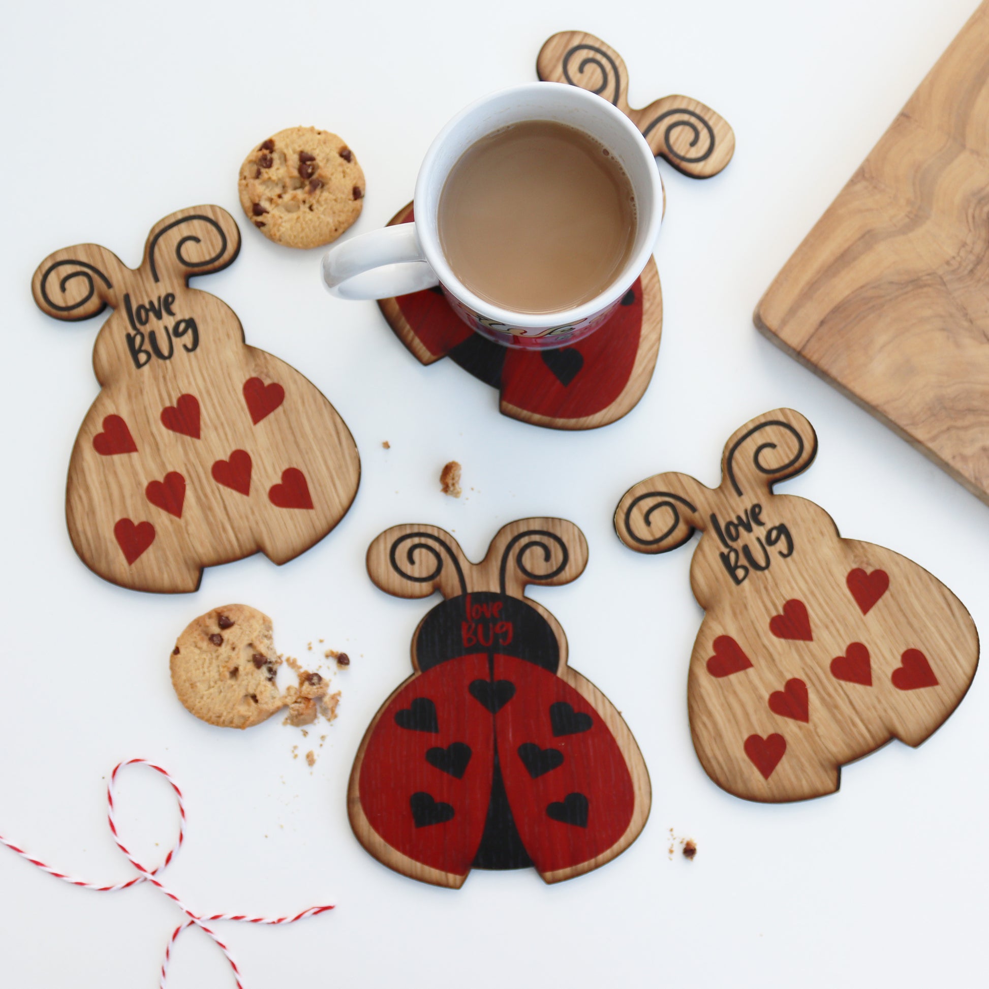 set of 4 wooden ladybird coasters 2 with a printed love bug and 2 with hearts valentines coasters