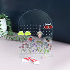 acrylic earring holder with a wild flower patterned printed onto the acrylic personalised with name