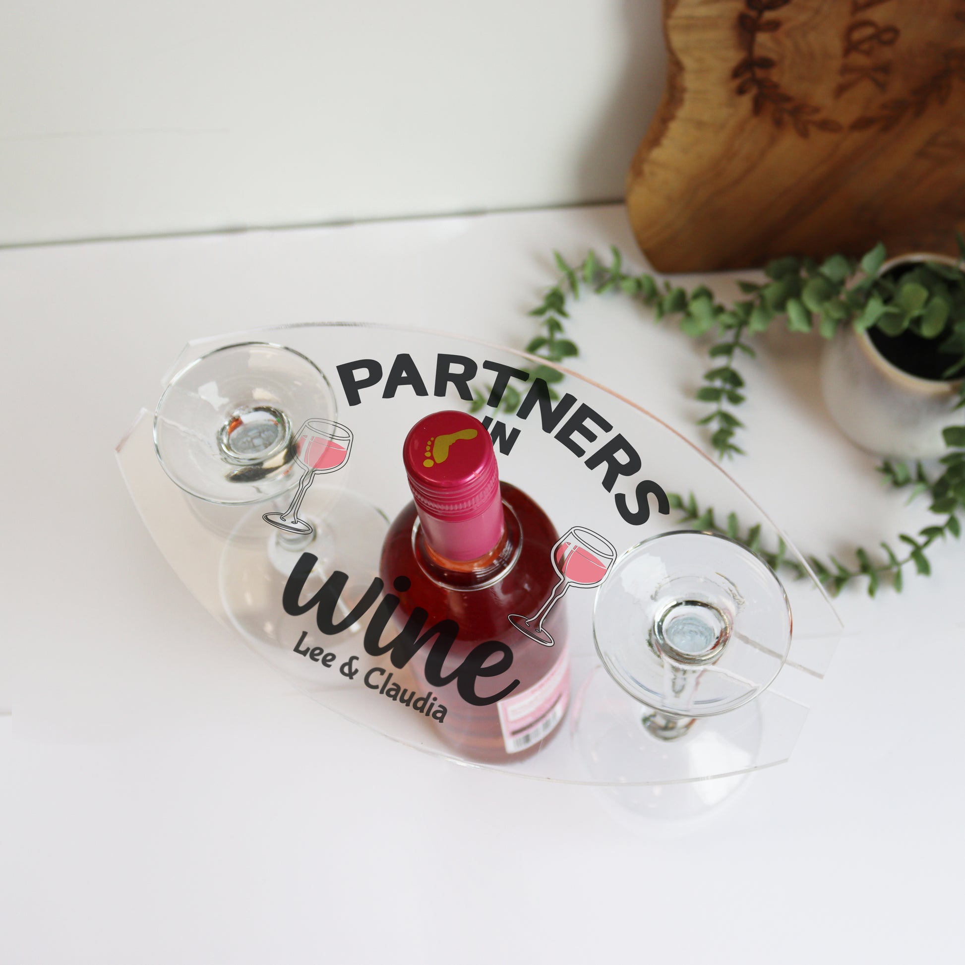 wine bottle and wine glass holder printed with the message partners in wine and two names can be added