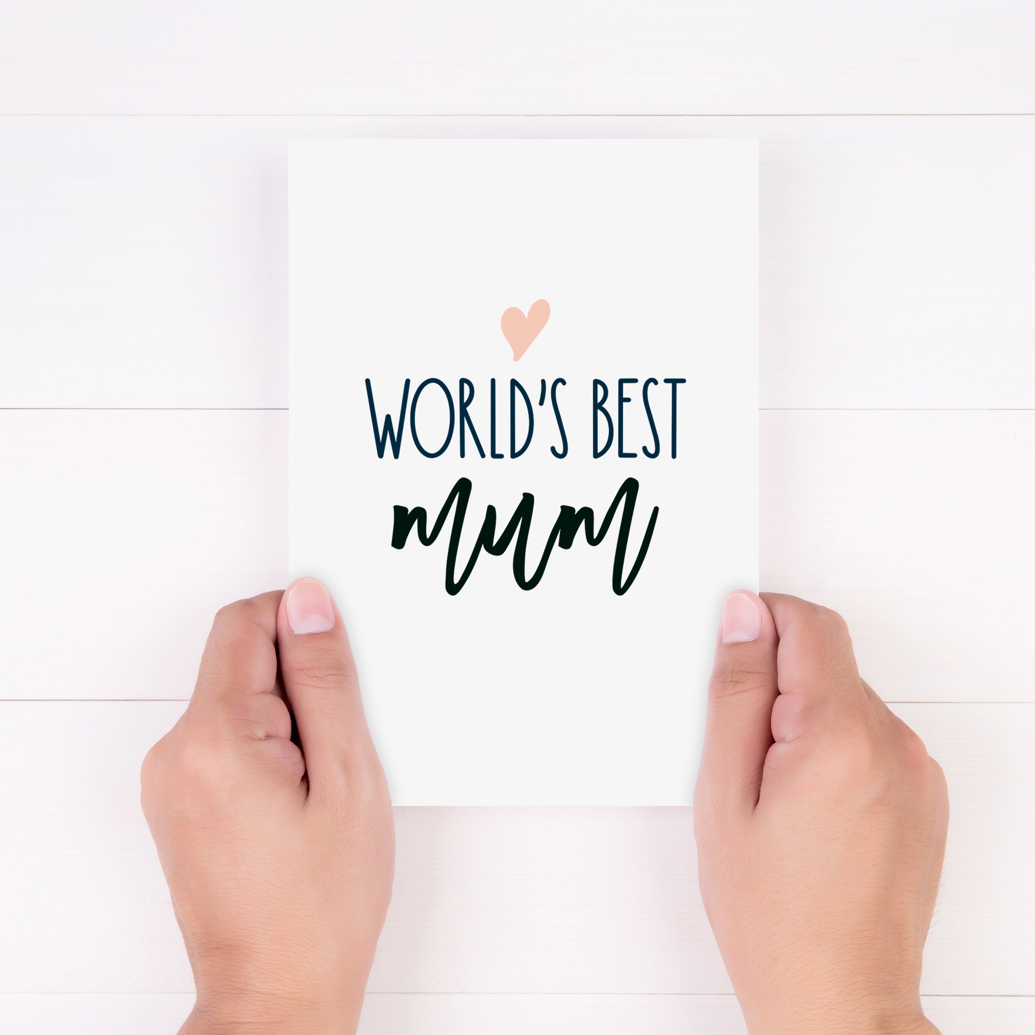 worlds best mum card shown being held in a woman's hands