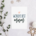 'World's best mum' card with peach heart, shown in a flat lay