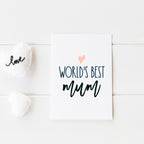 worlds best mum card with pink heart and writing shown on white background design with love heart