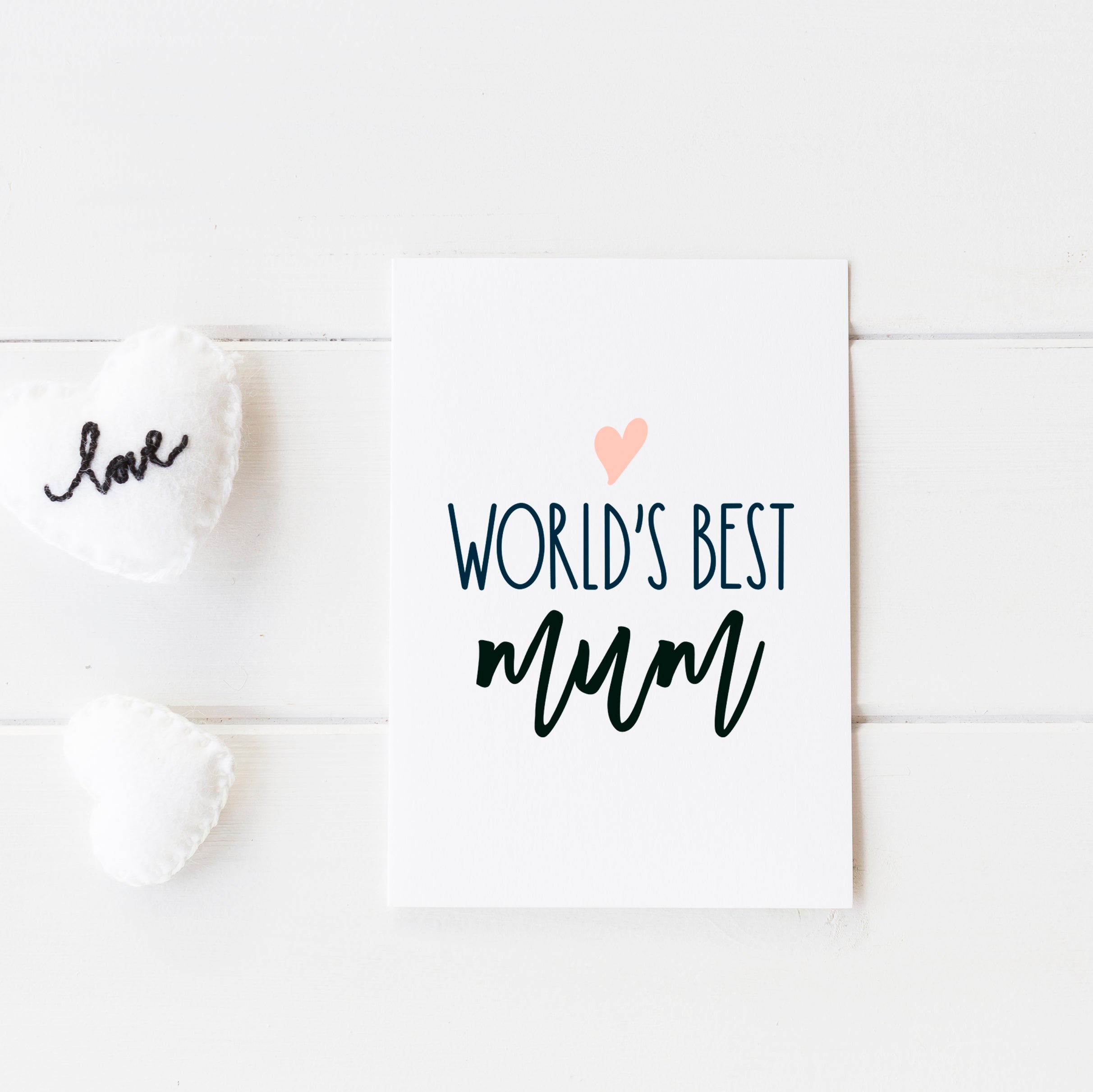 worlds best mum card with pink heart and writing shown on white background design with love heart