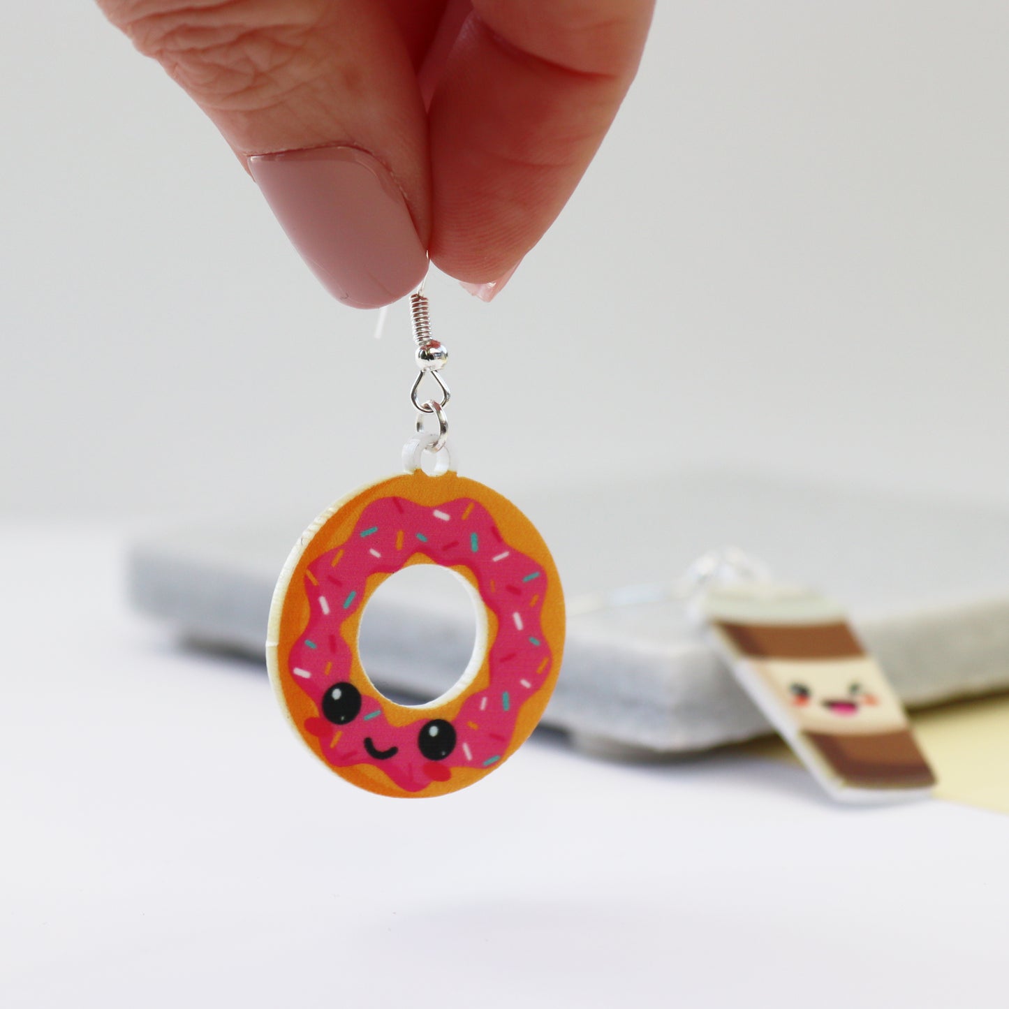 you are the donut to my coffee acrylic earrings handmade in UK donut earring being held