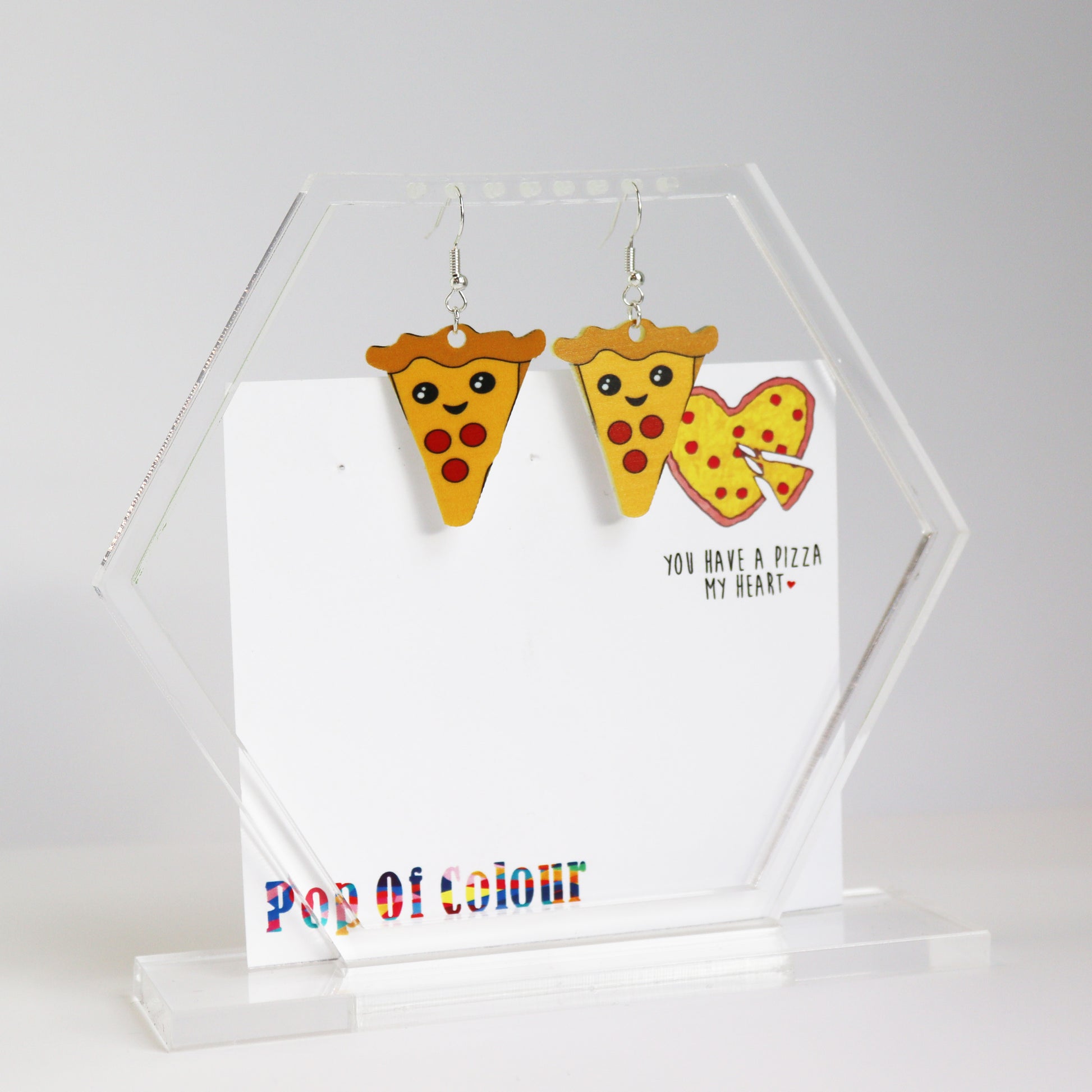 you have a pizza my heart earrings acrylic printed heart earrings shown in hanging acrylic earring holder